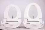 Round and elongated Infinity Eaze-Z3 bidet seats side by side with the seats lifted, showing the wash nozzles