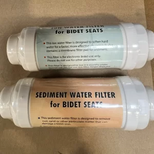 Two bidet water filters side by side: the ion filter with a green label and the sediment filter with an orange label